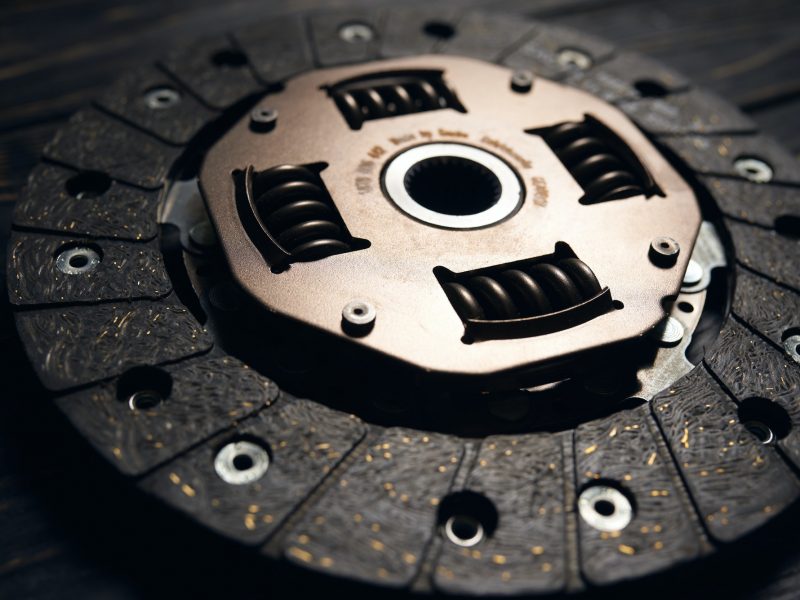 new car clutch kit on a dark wooden background. Close up